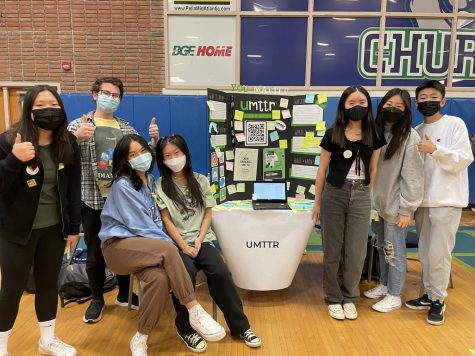 The ambassadors of the Umttr club at WCHS pose in front of their poster on club day on Nov. 11, 2021. The ambassadors were recruiting people for their club and gave all students the opportunity to join. 