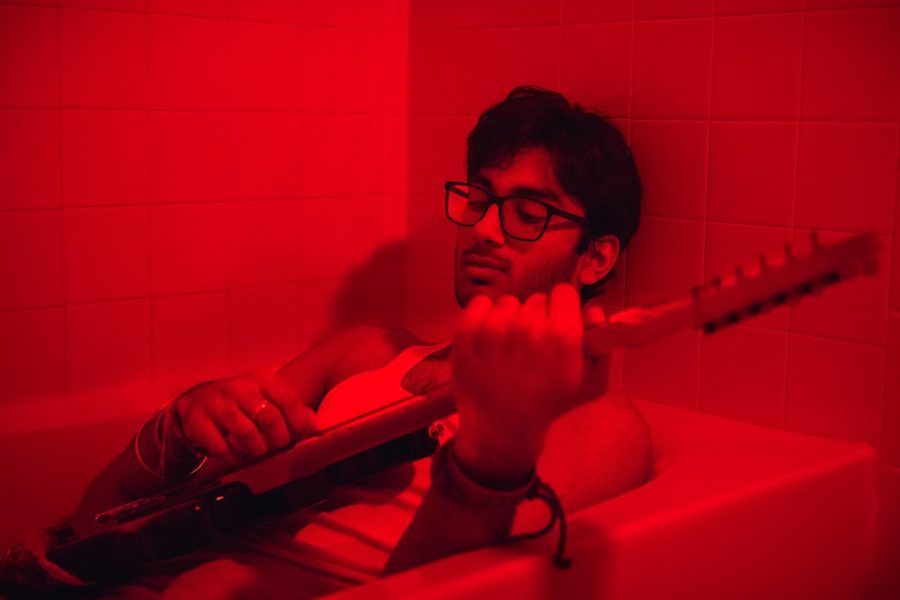 A+red-tinted+polaroid+of+Riyaan+Mendiratta+acts+as+the+album+cover+for+his+new+record%2C+Wallflower.+It+was+released+on+Jan.+6%2C+2023%2C+and+it+can+be+streamed+on+popular+music+platforms+such+as+Spotify%2C+Apple+Music%2C+and+more+under+the+name+RYIN.