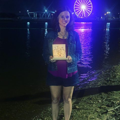 Sara Nemati, a biology teacher at WCHS, attends a lantern festival to make a wish for her IVF journey. Her lantern reads I want a baby girl.