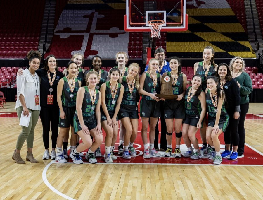The WCHS girls varsity basketball team smiles after a hard loss against Glen Burnie at the Class 4A MPSSAA state championship. 
