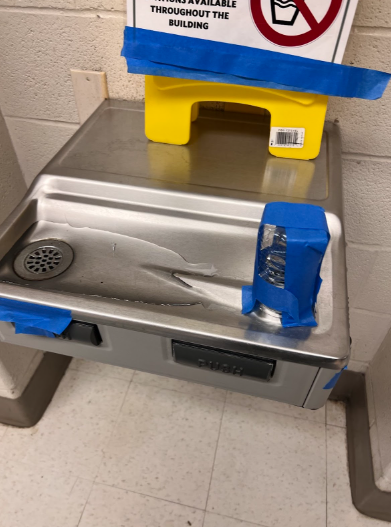 A broken water fountain at WCHS gets taken out of service after being covered in scotch tape and a plastic water bottle.