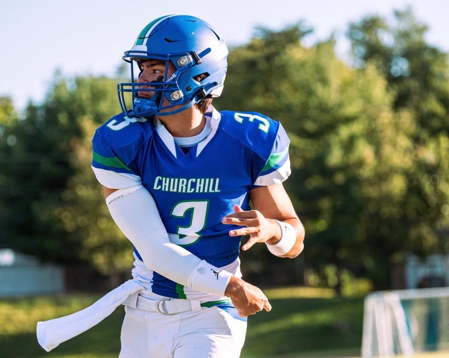 Starting quarterback, Justin Huebl, glances towards the football he just threw to a teammate. The WCHS football team finished with a successful season and made it to the state quarterfinals. 