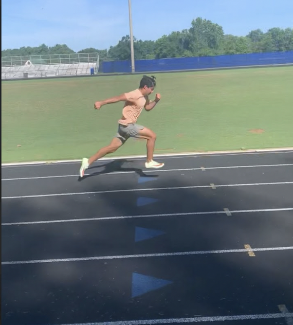 Arnav Juneja bursts into a sprint at track practice. The WCHS junior trains for his third competitive season on the track & field team.