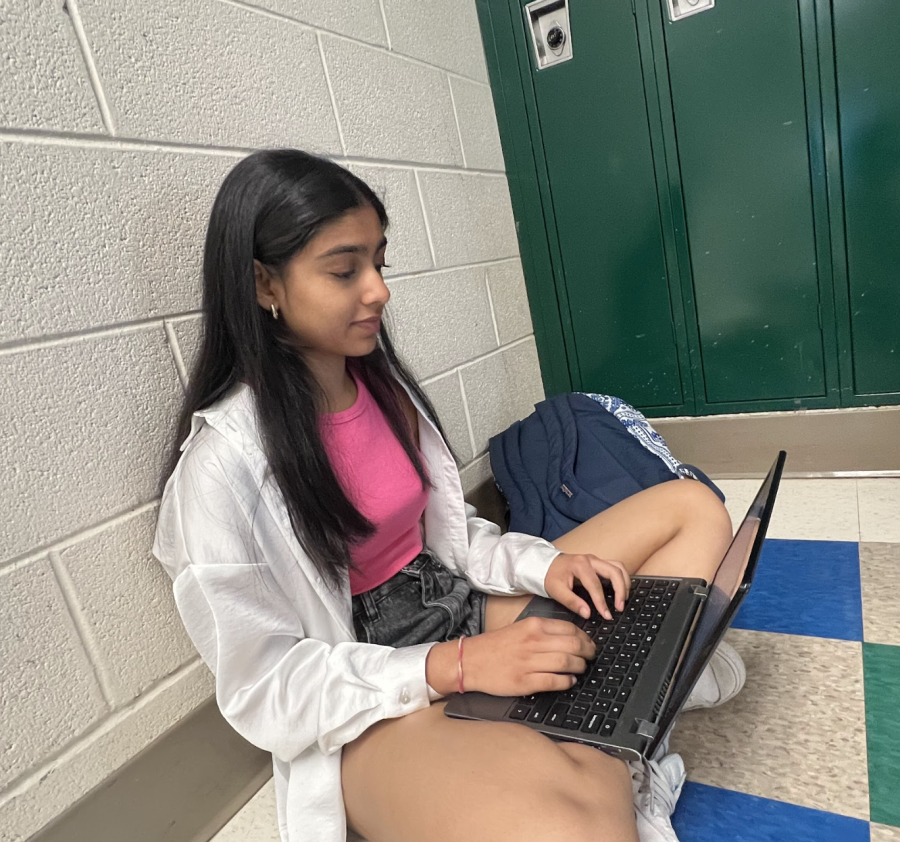 WCHS sophomore Eva Lee, a visual learner is reviewing a topic for her AP class by looking at a picture that provides a demonstration on April 16, 2023.