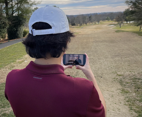On Wednesday, Feb. 15th, freshman Jaiden Chung watches the new Netflix documentary series Full Swing, while playing a round of golf at Bretton Woods Golf Club.
