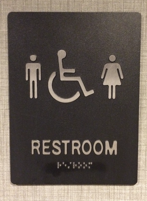A+gender-neutral+bathroom+sign+is+posted+in+order+to+allow+people+who+dont+identify+specifically+as+male+or+female.