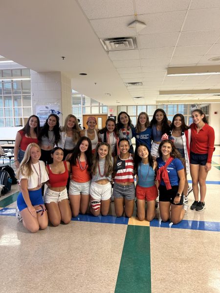 The WCHS Varsity Field Hockey team smiles for a team picture after one of their game day morning team breakfasts. The team is dressed in red, white and blue for their USA theme day. Team breakfasts and dressing up for school on game days are some of this teams oldest traditions and contributes to the closeness of this team.