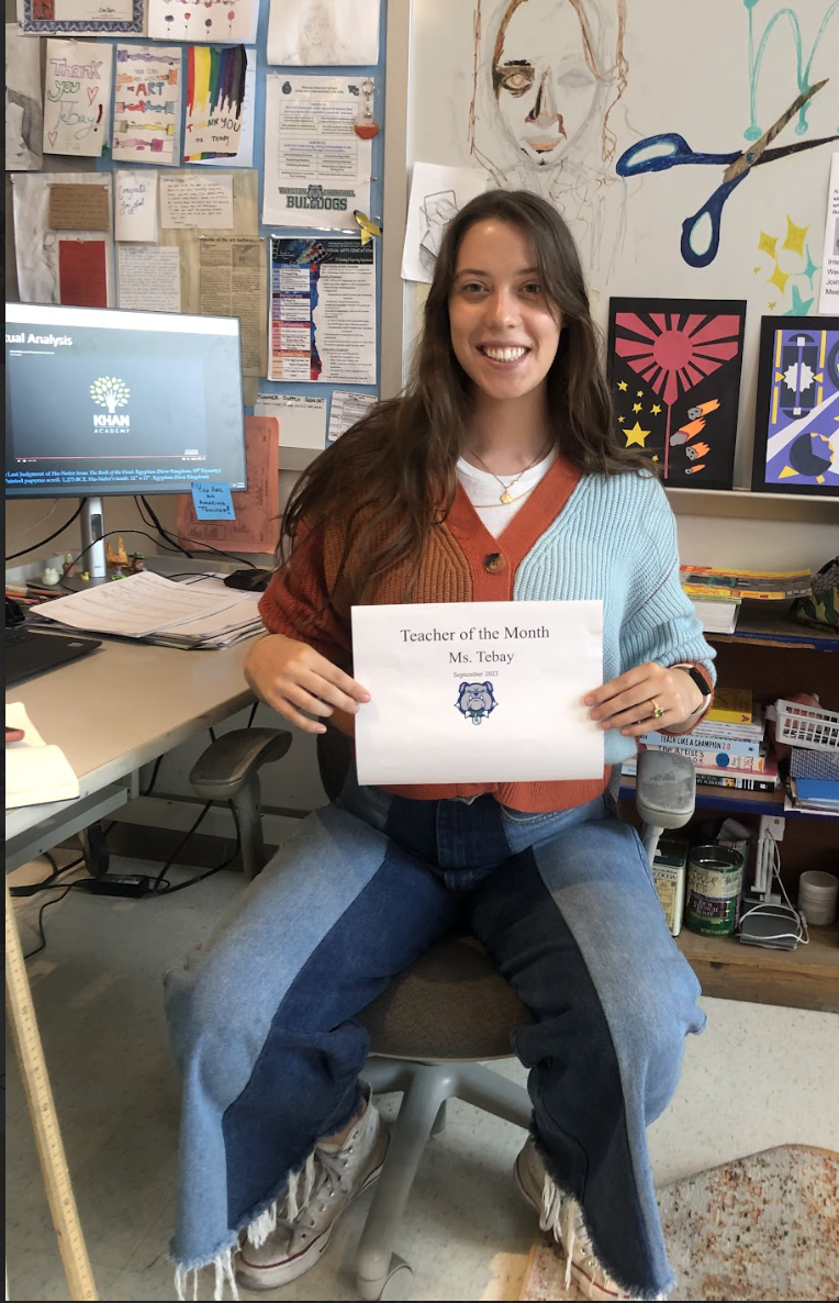 WCHS teacher Ms. Tebay smiles while holding her Teacher of the Month certificate. This is her second year teaching art at WCHS.