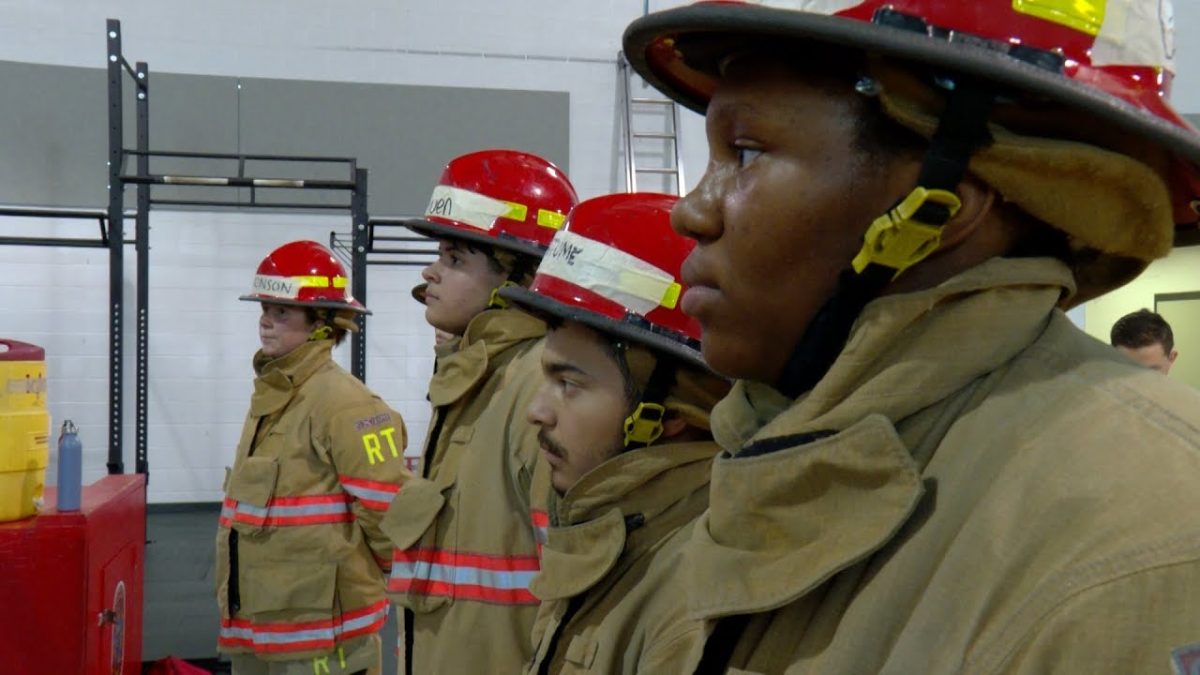 The Fire Science and Rescue Academy students are fully dressed in proper firefighting gear for a uniform check.