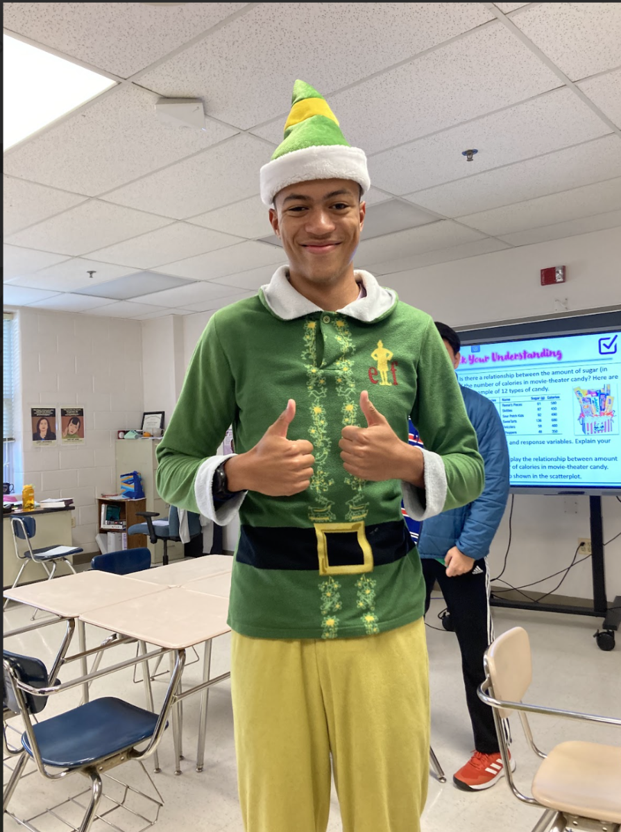 WCHS+senior+Andrew+Ashton%2C+one+of+the+few+who+participated+in+spirit+week+at+WCHS%2C+shows+off+his+spirit+by+wearing+elf+pajamas+during+Homecoming+Spirit+Week.+Themes+included+Pajama+Day%2C+Anything+But+a+Backpack+Day%2C+and+USA+Day.++