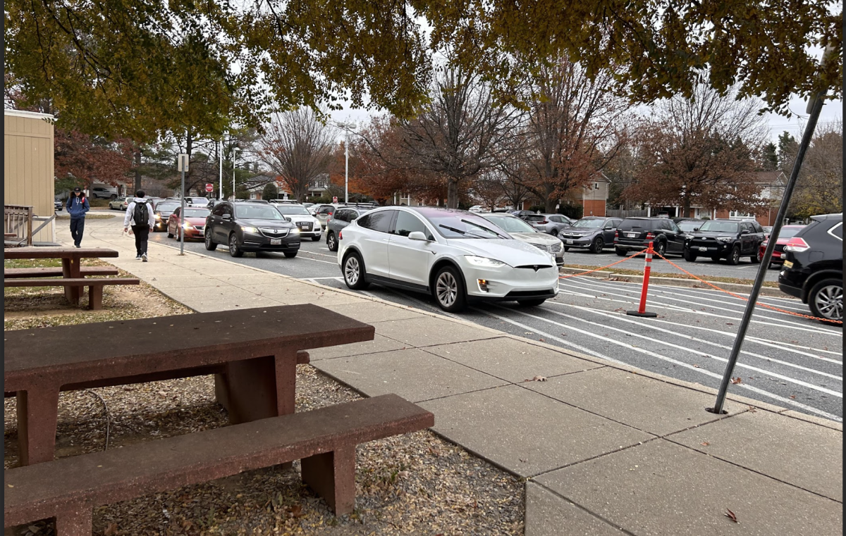 Multiple parents line up in the side parking lot at WCHS to drop off their kids Tuesday, November 20. Although its 5 minutes until school starts, parents and student drivers are still arriving and are rushing to leave.