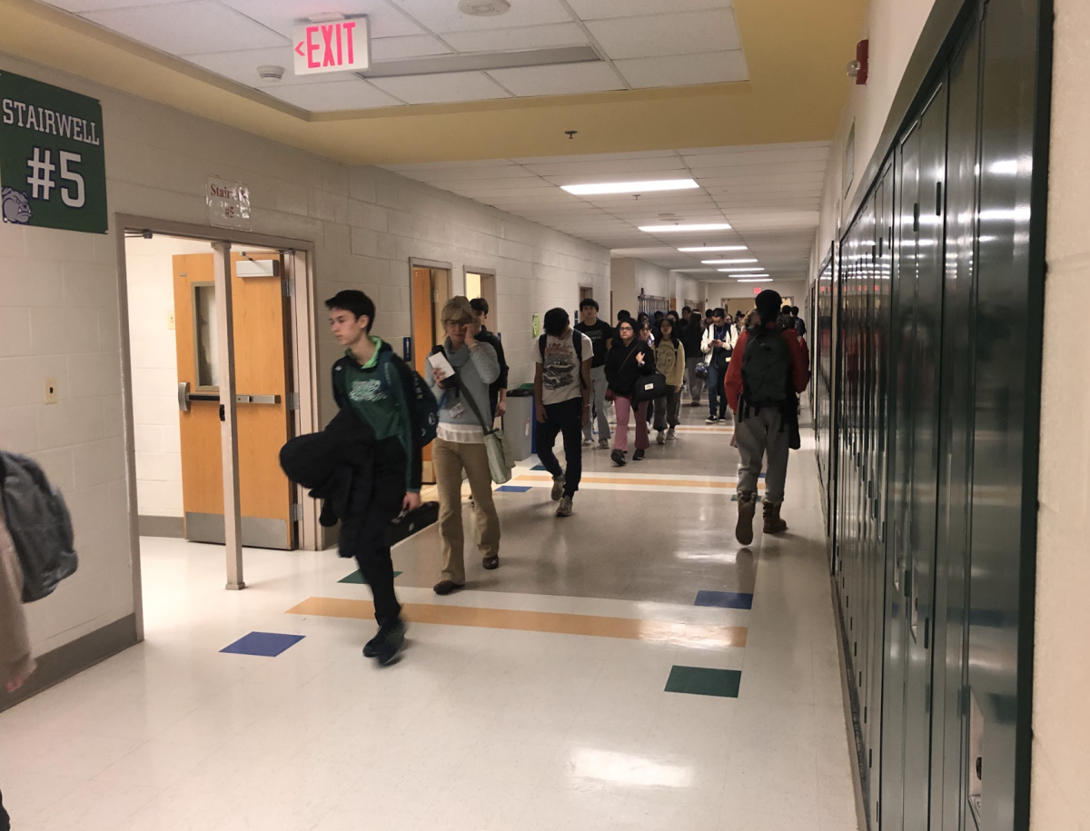 Students rush to seventh period on Tuesday Jan. 10, 2023 to avoid being swept in a possible hall sweep.