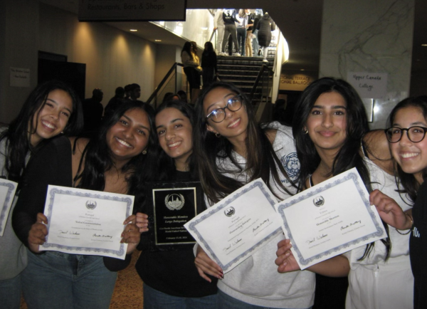 From left, WCHS students Mira Wedam, Sneha David, Pavania Durbhakula, Anjali Tatavarthy, Anchal Sharma and Riya Wedam pose on the last day of the four-day conference for a congratulatory photo, holding their respective awards.