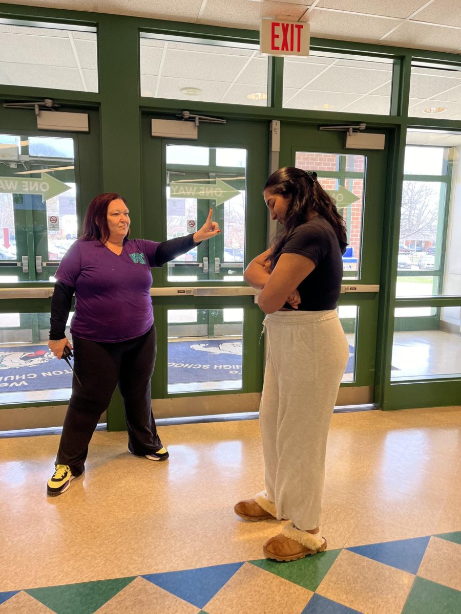 WCHS senior Sneha David is stopped in her attempt to leave school during lunch. The recent changes to WCHS lunch rules have prohibited seniors like David from going off campus during lunch.