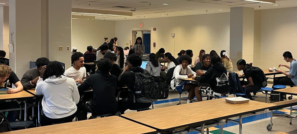 WCHS students eat lunch in the cafeteria on April 23. WCHS offers various options for the daily lunch, from hot pizzas to refrigerated salads.