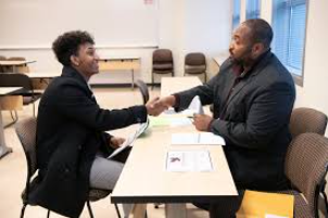 A student at an on-the-spot-admissions event at Seneca Valley Highschool in Montgomerey County learns about his options.	