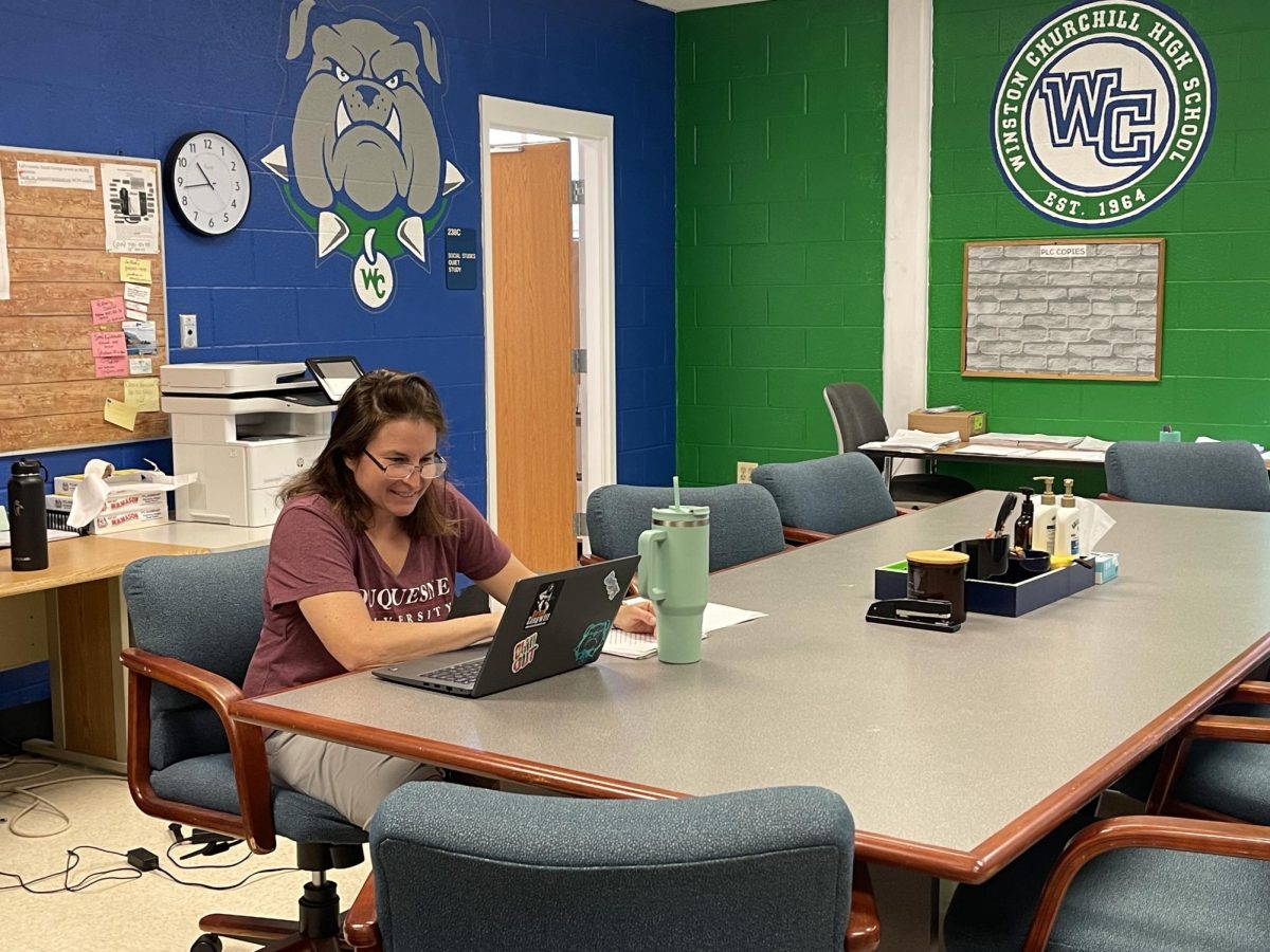 WCHS social studies teacher Jamie Frank grades students' papers following the structure of the current 2025 grading policy, which the BOE is reconsidering.