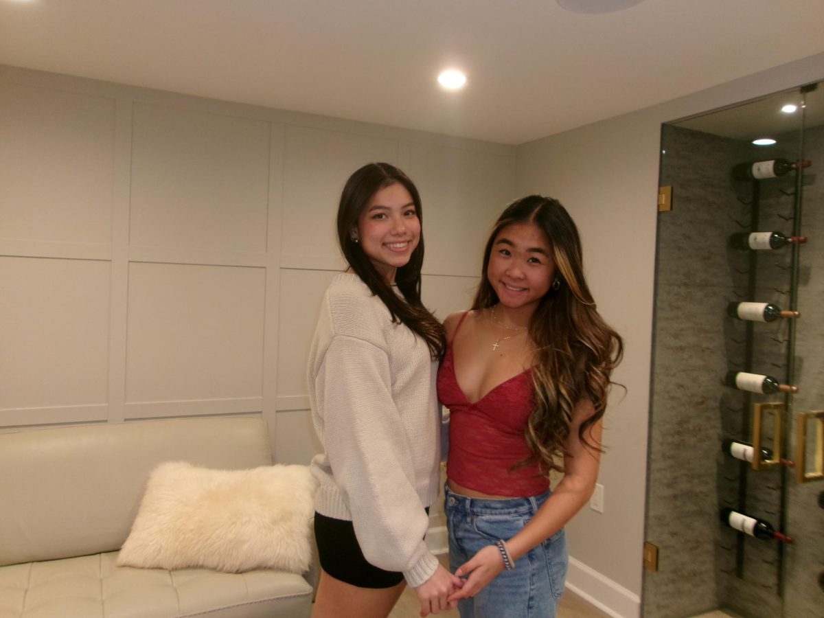 Mini skirts and low-rise jeans are just as popular today as they were in the early 2000s. Sophomore Leah Shive, left, is wearing a mini-skirt and accompanied by sophomore Katelin Chew, right, who is wearing a low-rise jean. 