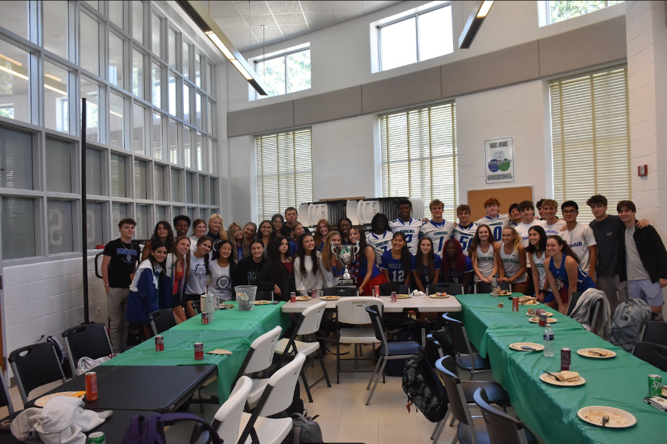 On September 12, the Varisty sports team captains surrounded a new addition to WCHS' trophies, the Legacy Cup. Based on all the Varsity scores across all three seasons last year, WCHS was declared the winner. 
