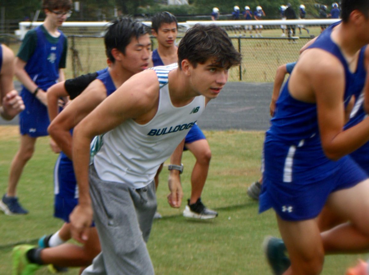 WCHS senior Santiago Gutierrez leads the WCHS cross country team in strides before the beginning of a meet against Montgomery Blair HS and Walt Whitman HS in September.