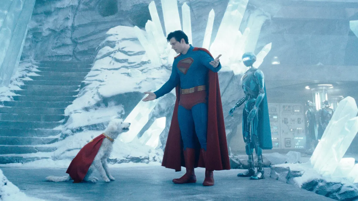 Superman stands in his lair before his dog (Krypto), after returning from an intense battle against a powerful foe. 