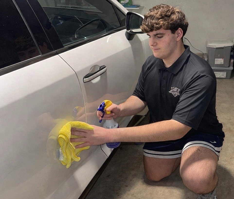 WCHS Sophomore Ryan Butchko finishes cleaning a clients car for his company Auto Doctor Detailing on January 13th. Auto Doctor Detailing focuses on the customer experience and providing great service for their clients.
