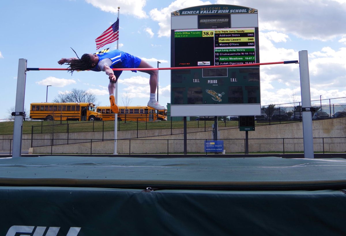 Bakari Taylor clears the High Jump bar at a March 2025 multi-school meet held at Seneca Valley High School.
