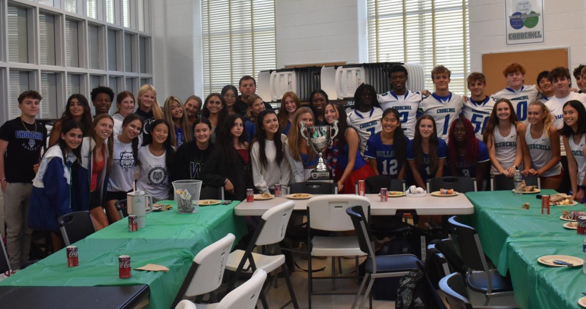 On September 12, the Varsity sports team captains surrounded a new addition to WCHS' trophies, the Legacy Cup. Based on all the Varsity scores across all three seasons last year, WCHS was declared the winner.	