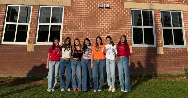 On 'What's next?' day, WCHS Seniors gather outside of WCHS in T-Shirts of the college they plan to attend after high school. It is common for many seniors to take photos with their friends, ensuring their memories from high school will not be forgotten.